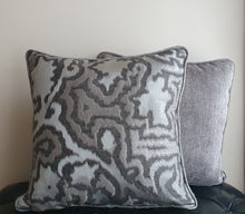 Load image into Gallery viewer, Hazeldee Home Limited Edition Handmade double-sided silver grey cushion using two luxurious silk blend Sahco fabrics.  A bold and mesmerising jacquard organic tentril swirl design that has a three dimensional effect on one side and a shimmering iridescent silk linen semi-plain fabric on the reverse, edged with the same semi plain fabric.   Approximately 18" x 18" (45cm x 45cm) square with a concealed zip.