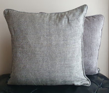 Load image into Gallery viewer, Hazeldee Home Limited Edition Handmade double-sided silver grey cushion using two luxurious silk blend Sahco fabrics.  A bold and mesmerising jacquard organic tentril swirl design that has a three dimensional effect on one side and a shimmering iridescent silk linen semi-plain fabric on the reverse, edged with the same semi plain fabric.   Approximately 18" x 18" (45cm x 45cm) square with a concealed zip.