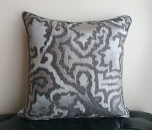 Load image into Gallery viewer, Hazeldee Home Limited Edition Handmade double-sided silver grey cushion using two luxurious silk blend Sahco fabrics.  A bold and mesmerising jacquard organic tentril swirl design that has a three dimensional effect on one side and a shimmering iridescent silk linen semi-plain fabric on the reverse, edged with the same semi plain fabric.   Approximately 18" x 18" (45cm x 45cm) square with a concealed zip.