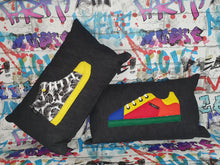 Load image into Gallery viewer, Hazeldee Home Handmade bold colour-block trainer cushion, rectangular bolster shape with real laces trim on a black denim base. A great conversational trainer cushion for kids and grown ups alike! Bring some fun and colour into your space with this handmade cushion with a trainer with laces detail! colour-block sneaker trainer cushion with Hazeldee Home label detail. Approximately 12" x 20" (30cm x 50cm) with a zip opening. Comes with a polycotton cushion inner.