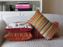 Load image into Gallery viewer, Hazeldee Home Handmade multi stripe lumbar rectangle cushion using a luxurious stripe velvet design for the front with oatmeal, rust, cream, cardamom and hints of lilac and purple. The reverse features an Italian velvet fabric in a rich sumptuous rust colour.  Together these colours beautifully depict colours of Marrakesh and add bold colour to any room.  Approximately 12" x 20" (30cm x 50cm) with a concealed zip.  Comes with a polycotton lined cushion inner.
