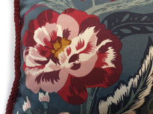 Load image into Gallery viewer, Handmade double-sided cushion with a fresh botanical green based wild flower floral print on one side and rich Italian velvet in burgundy on the reverse, edged with a contrasting burgundy intricate interwoven rope.   Fully reversible, double sided cushion.  Why have one cushion, when you can have 2?!  Approximately 16" x 16" (40cm x 40cm) square with a concealed zip.  Comes with a polycotton lined cushion inner.  Close up of the wild flower print and the hand sewn rope trim