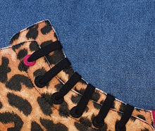 Load image into Gallery viewer, Hazeldee Home Close Up on the Laces Handmade hi-top trainer cushion, rectangular bolster shape with real laces trim on a blue denim base. A great conversational trainer cushion for kids and grown ups alike! Bring some fun and colour into your space with this handmade cushion with a hi-top trainer with laces detail! Natural Leopard print hi-top sneaker trainer cushion with contrast bright pink detail. Approximately 12" x 20" (30cm x 50cm) with a zip opening.