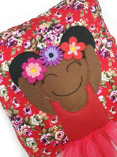 Load image into Gallery viewer, Frida Kahlo cushion inspired by artist Frida Kahlo with trim and legs that extend from the body of the cushion.    Designed and handmade by Hazeldee Home, these cushions are a bundle of fun! Each Cushion is one-of-a-kind with bright backgrounds, different skin tones and hairstyles with flowers to match!   Frida Kahlo was a Mexican painter known for self-portraits and use of bright colour.   Approximately 16" x 16" (40cm x 40cm) with a centre back zip. Comes with a polycotton cushion inner.