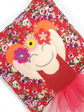 Load image into Gallery viewer, Frida Kahlo cushion inspired by artist Frida Kahlo with trim and legs that extend from the body of the cushion.    Designed and handmade by Hazeldee Home, these cushions are a bundle of fun! Each Cushion is one-of-a-kind with bright backgrounds, different skin tones and hairstyles with flowers to match!   Frida Kahlo was a Mexican painter known for self-portraits and use of bright colour.   Approximately 16" x 16" (40cm x 40cm) with a centre back zip. Comes with a polycotton cushion inner.