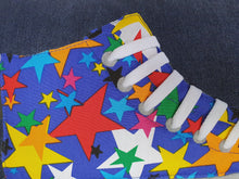 Load image into Gallery viewer, Blue star print hi-top sneaker trainer cushion. Colourful scattered stars on a bright blue base injects bold colour and fun into this cushion!