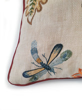 Load image into Gallery viewer, Hazeldee Home Limited Edition Handmade double-sided cushion using the luxurious Colefax and Fowler heavily embroidered floral foliage design fabric on a linen/viscose base on one side and Italian velvet terracotta on the reverse, edged with satin trim.   The front features an intricate floral design reminiscent of a tudor floral design with hues of rust, gold, navy light and mid blues on a linen blend neutral base with a subtle herringbone semi-plain weave that adds dimension depth and interest.