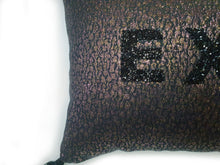 Load image into Gallery viewer, Hazeldee Home Handmade metallic black pink and gold leopard metallic jacquard cushion with black rhinestone embellished letters spelling 'EXTRA' and finished with bold silky black tassels.   The metallic fabric has a black base glimmers pink and gold  its bold yet paired back.   Black rhinestone letters continues the bold but paired back theme.  Perfect for the person who loves a little something 'EXTRA' or 'BOUJEE' and lives life as such!