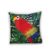 Load image into Gallery viewer, Hazeldee Home Handmade Parrot bird illustration character cushion with 3D feather effect trim.      A great conversational parrot cushion for kids and grown ups alike!  Bring some fun and colour into your space with this handmade cushion with a bold red parrot cushion with plume of red, yellow and blue feather-like trim with a tropical leaf fabric base!  A one-of-a-kind Hazeldee Home design.  Approximately 16" x 16" (40cm x 40cm) with a centre back zip. Comes with a polycotton cushion inner.