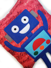 Load image into Gallery viewer, Hazeldee Home Handmade Robot Munchkin Cushion with trim detail and legs that extend from the body of the cushion.    Designed and handmade by Hazeldee Home, these cushions are a bundle of fun! Each Cushion is one-of-a-kind with bright backgrounds and bold contrasting robot character detail!   Approximately 16" x 16" (40cm x 40cm) with a centre back zip. Comes with a polycotton cushion inner.    Each Hazeldee Home Munchkin Character Cushion comes with a numbered Certificate of Authenticity.