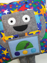 Load image into Gallery viewer, Hazeldee Home Handmade Robot Munchkin Cushion with trim detail and legs that extend from the body of the cushion.    Designed and handmade by Hazeldee Home, these cushions are a bundle of fun! Each Cushion is one-of-a-kind with bright backgrounds and bold contrasting robot character detail!   Approximately 16" x 16" (40cm x 40cm) with a centre back zip. Comes with a polycotton cushion inner.    Each Hazeldee Home Munchkin Character Cushion comes with a numbered Certificate of Authenticity.