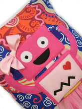 Load image into Gallery viewer, Hazeldee Home Handmade Robot Munchkin Cushion with trim detail and legs that extend from the body of the cushion.    Designed and handmade by Hazeldee Home, these cushions are a bundle of fun! Each Cushion is one-of-a-kind with bright backgrounds and bold contrasting robot character detail!   Approximately 16" x 16" (40cm x 40cm) with a centre back zip. Comes with a polycotton cushion inner.    Each Hazeldee Home Munchkin Character Cushion comes with a numbered Certificate of Authenticity.