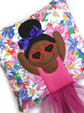 Load image into Gallery viewer, Handmade Munchkin cushion with heart sunglasses with trim and legs and tutu skirt that extend from the body of the cushion. Designed and handmade by Hazeldee Home, these cushions are a bundle of fun! Each Cushion is one-of-a-kind with bright backgrounds, different skin tones and hairstyles with bows to match! Approximately 16" x 16" (40cm x 40cm) with a centre back zip. Comes with a polycotton cushion inner. Each Hazeldee Home Munchkin Cushion comes with a numbered Certificate of Authenticity.