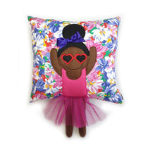 Load image into Gallery viewer, Handmade Munchkin cushion with heart sunglasses with trim and legs and tutu skirt that extend from the body of the cushion. Designed and handmade by Hazeldee Home, these cushions are a bundle of fun! Each Cushion is one-of-a-kind with bright backgrounds, different skin tones and hairstyles with bows to match! Approximately 16" x 16" (40cm x 40cm) with a centre back zip. Comes with a polycotton cushion inner. Each Hazeldee Home Munchkin Cushion comes with a numbered Certificate of Authenticity.