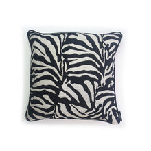 Load image into Gallery viewer, Hazeldee Home Limited Edition Handmade double-sided cushion with a bold monochrome cotton blend jacquard zebra design on one size and a vibrant fuchsia pink Italian cotton velvet on the reverse edged with a black cotton trim.     This cushion is fully reversible so you essentially get two looks in one!    Approximately 16" x 16" (40cm x 40cm) square with a concealed zip.   Comes with a polycotton lined cushion inner.  Do not wash, Dry Clean Only.