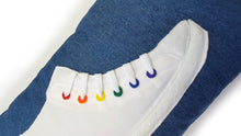 Load image into Gallery viewer, Hazeldee Home Handmade hi-top trainer cushion with real laces trim on a blue denim base.  We kept this version box fresh white and added colourful rainbow rivet detail for subtle colour and fun.  A great conversational trainer cushion for kids and grown ups alike!  Bring some fun and colour into your space with this handmade cushion with a hi-top trainer with laces detail!  White hi-top sneaker trainer cushion with rainbow coloured eyelets.  Approximately 12" x 20" (30cm x 50cm) with a zip opening.