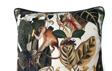 Load image into Gallery viewer, Hazeldee Home Limited Edition Handmade double-sided cushion with an intricate animal design inspired by the African Savannas featuring zebras, leopards, cheetahs, monkeys and more paired back with bold green plants and flowers on a neutral cream background.   The reverse features a tonal cream cotton velvet and forest green cotton piping trim.   This cushion is fully reversible so you get two looks in one!    Approximately 16" x 16" (40cm x 40cm) square with a concealed zip.