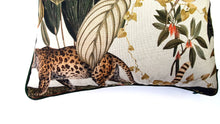 Load image into Gallery viewer, Hazeldee Home Limited Edition Handmade double-sided cushion with an intricate animal design inspired by the African Savannas featuring zebras, leopards, cheetahs, monkeys and more paired back with bold green plants and flowers on a neutral cream background.   The reverse features a tonal cream cotton velvet and forest green cotton piping trim.   This cushion is fully reversible so you get two looks in one!    Approximately 16" x 16" (40cm x 40cm) square with a concealed zip.