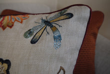 Load image into Gallery viewer, Hazeldee Home Limited Edition Handmade double-sided cushion using the luxurious Colefax and Fowler heavily embroidered floral foliage design fabric on a linen/viscose base on one side and Italian velvet terracotta on the reverse, edged with satin trim.   The front features an intricate floral design reminiscent of a tudor floral design with hues of rust, gold, navy light and mid blues on a linen blend neutral base with a subtle herringbone semi-plain weave that adds dimension depth and interest.