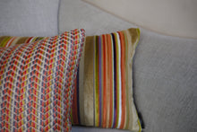 Load image into Gallery viewer, Hazeldee Home Handmade multi stripe lumbar rectangle cushion using a luxurious stripe velvet design for the front with oatmeal, rust, cream, cardamom and hints of lilac and purple. The reverse features an Italian velvet fabric in a rich sumptuous rust colour.  Together these colours beautifully depict colours of Marrakesh and add bold colour to any room.  Approximately 12" x 20" (30cm x 50cm) with a concealed zip.  Comes with a polycotton lined cushion inner.