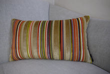 Load image into Gallery viewer, Hazeldee Home Handmade multi stripe lumbar rectangle cushion using a luxurious stripe velvet design for the front with oatmeal, rust, cream, cardamom and hints of lilac and purple. The reverse features an Italian velvet fabric in a rich sumptuous rust colour.  Together these colours beautifully depict colours of Marrakesh and add bold colour to any room.  Approximately 12" x 20" (30cm x 50cm) with a concealed zip.  Comes with a polycotton lined cushion inner.
