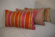 Load image into Gallery viewer, Hazeldee Home multicoloured stripe lumbar cushion using a beautifully heavy woven fabric with a herringbone detail on a neutral base.  A multicoloured stripe on the front - An off-white textured Italian cotton velvet on the reverse.  This cushion has a wonderfully homely feel to it.  The texture gives dimension and depth and is bold yet neutral due to its neutral undertone.  Approximately 12" x 20" (30cm x 50cm) with a concealed zip.  Comes with a polycotton lined cushion inner.