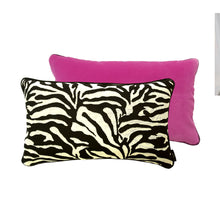 Load image into Gallery viewer, Hazeldee Home Limited Edition Handmade double-sided cushion with a bold monochrome cotton blend jacquard zebra design on one size and a vibrant fuchsia pink Italian cotton velvet on the reverse edged with a black cotton trim.     This cushion is fully reversible so you essentially get two looks in one!    Approximately 12" x 20" (30cm x 50cm) rectangle with a concealed zip.   Comes with a polycotton lined cushion inner.