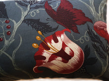Load image into Gallery viewer, Hazeldee Home Handmade botanical green based wild flower floral print cotton cushion with Hazeldee Home's trademark contrast silky double tassels detailing.   Inspired by European botanical gardens, this floral print features playfully bold wild flowers with other wildlife in the form of whimsical butterflies berries and tree branches detailed within the print.  A truly enchanting design.