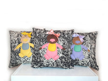 Load image into Gallery viewer, Hazeldee Home Handmade Munchkin Baby cushion on a monochrome floral base. The Munchkin Babies are an extension of the Munchkin Collection and are a great baby shower gift to welcome a new born baby to the world! They are a fantastic addition to a nursey or playroom. Approximately 16" x 16" (40cm x 40cm) with a zip at the base. Comes with a polycotton cushion inner. Each Hazeldee Home Munchkin Character Cushion comes with a numbered Certificate of Authenticity. Please note THIS IS NOT A TOY.