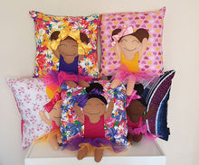 Load image into Gallery viewer, Hazeldee Home Handmade character kid's cushion with trim and legs that extend from the body of the cushion. Designed and handmade by Hazeldee Home, these cushions are a bundle of fun! Each Cushion is one-of-a-kind with bright backgrounds, different skin tones and hairstyles with bows to match! Approximately 16" x 16" (40cm x 40cm) with a centre back zip. Comes with a polycotton cushion inner. Each Hazeldee Home Munchkin Character Cushion comes with a numbered Certificate of Authenticity.