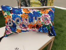 Load image into Gallery viewer, Hazeldee Home Handmade blue floral print cushion with rainbow rhinestone embellished letters spelling &#39;BOUJEE&#39; and finished with bold silky black tassels.   The silky base exudes glamour and adds a level  of decadence to the the cushion.   Bold rainbow rhinestone letters bring out the bold blues, pinks, oranges and greens along.  Perfect for the person who loves a little something &#39;BOUJEE&#39; or &#39;EXTRA&#39; and lives life as such!

