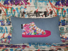 Load image into Gallery viewer, Hazeldee Home Handmade hi-top trainer cushion, rectangular bolster shape with real laces trim on a blue denim base.  A great conversational trainer cushion for kids and grown ups alike!  Bring some fun and colour into your space with this handmade cushion with a hi-top trainer with laces detail!  Bold floral print hi-top sneaker trainer cushion with contrast fuchsia pink detail.  Approximately 12&quot; x 20&quot; (30cm x 50cm) with a zip opening.   Comes with a polycotton cushion inner.
