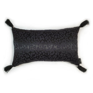 Hazeldee Home handmade black leopard cushion with bold silky black tassels.  Perfect for living rooms and bedrooms alike.  A classy take on leopard that acts as a semi-plain print with silky and mat jacquard.  And of course those tassels add that extra touch of glamour!  Check out the matching Ruffle square cushion!  Both items are Limited Edition one of a kind (for now)...  Approximately 12" x 20" (30cm x 50cm) with a concealed zip.  Comes with a polycotton cushion inner.  Do not wash, Dry Clean Only.