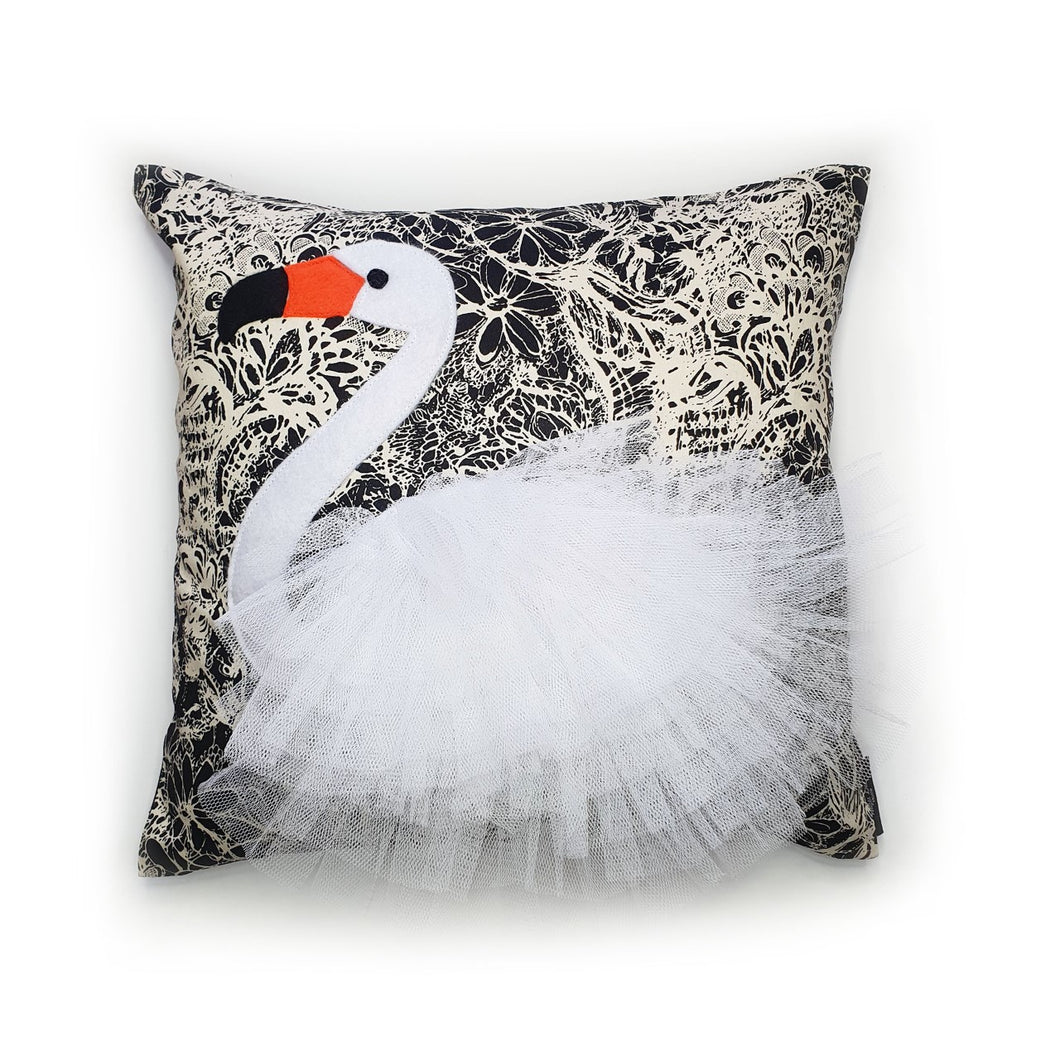 Hazeldee Home Handmade swan bird illustration character cushion with 3D feather effect trim.   A great conversational swan cushion for kids and grown ups alike!  Bring some fun and colour into your space with this handmade cushion with a white swan cushion with plume of white feather-like trim with a twill fabric floral monochrome base!  A Hazeldee Home design.  Approximately 16