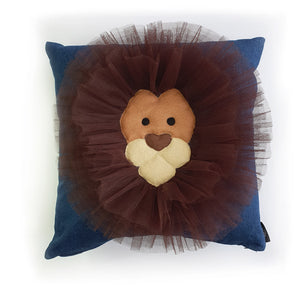 Hazeldee Home Handmade Lion Head cushion with 3D mane trim.      A great conversational Lion cushion!  Bring some fun and colour into your space with this handmade cushion with a natural lion head cushion with 3D mane trim on a mid blue washed denim fabric base!  A one-of-a-kind Hazeldee Home design.  Approximately 16" x 16" (40cm x 40cm) with a zip at the base.