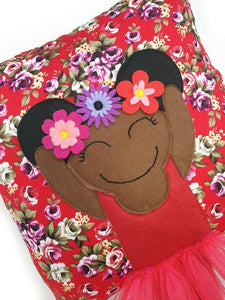 Frida Kahlo cushion inspired by artist Frida Kahlo with trim and legs that extend from the body of the cushion.    Designed and handmade by Hazeldee Home, these cushions are a bundle of fun! Each Cushion is one-of-a-kind with bright backgrounds, different skin tones and hairstyles with flowers to match!   Frida Kahlo was a Mexican painter known for self-portraits and use of bright colour.   Approximately 16" x 16" (40cm x 40cm) with a centre back zip. Comes with a polycotton cushion inner.