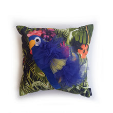 Load image into Gallery viewer, Handmade Parrot bird illustration character cushion with 3D feather effect trim. A great conversational parrot cushion for kids and grown ups alike! Bring some fun and colour into your space with this handmade cushion with a bold blue parrot cushion with plume of blue and yellow feather-like trim with a tropical leaf fabric base! A one-of-a-kind Hazeldee Home design. Approximately 16&quot; x 16&quot; (40cm x 40cm) with a centre back zip. Comes with a polycotton cushion inner.
