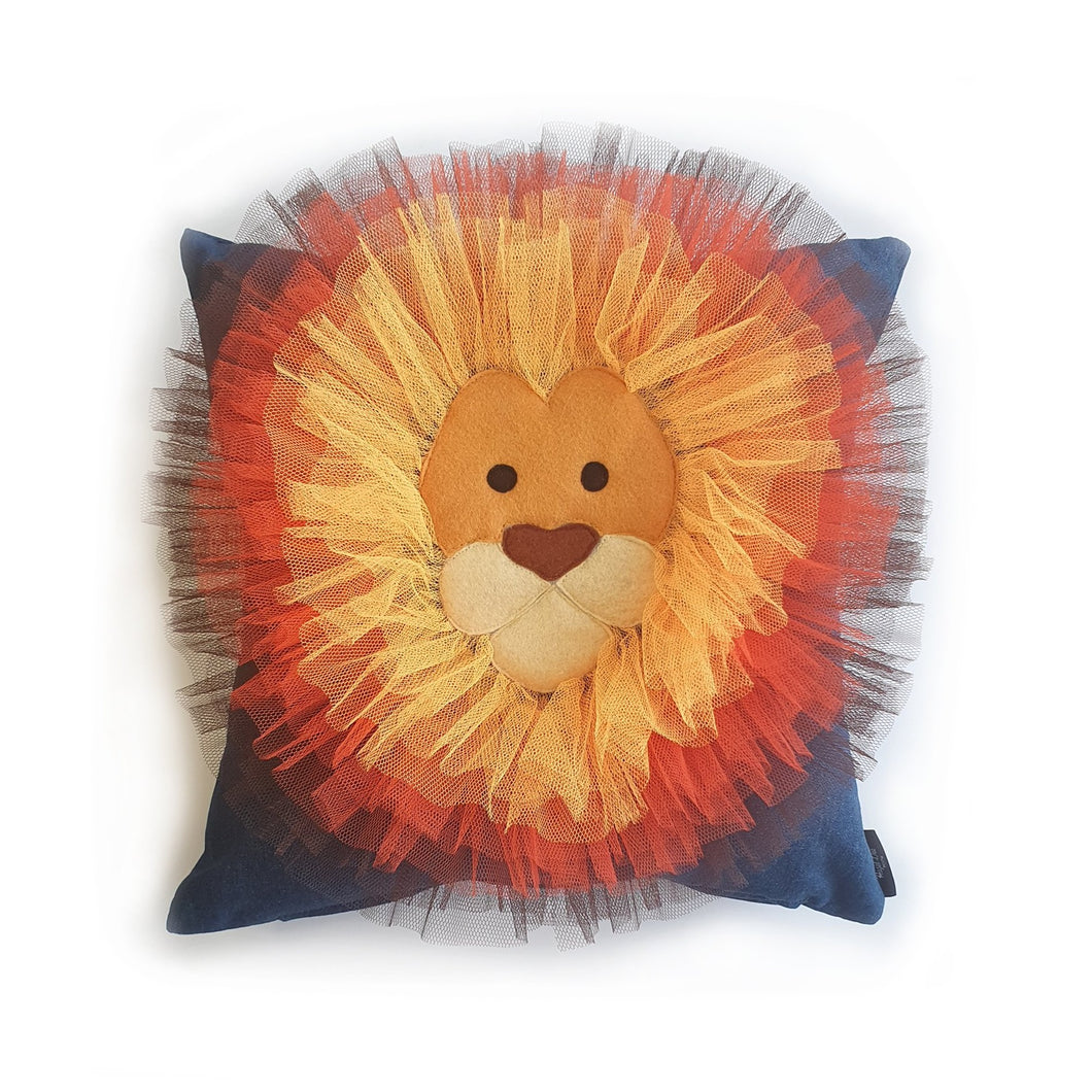 Hazeldee Home Handmade Lion Head illustration character cushion with 3D mane trim.      A great conversational Lion cushion!  Bring some fun and colour into your space with this handmade cushion with a neutral yet striking lion head cushion with 3D mane trim on a mid blue washed denim fabric base!  A one-of-a-kind Hazeldee Home design.  Approximately 16