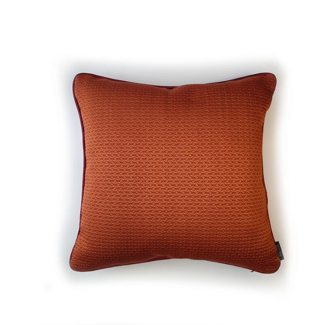 Hazeldee Home handmade double-sided cushion featuring decadent silky geometric jacquard with tones of paprika chilli with contrasting silky trim.  Approximately 18