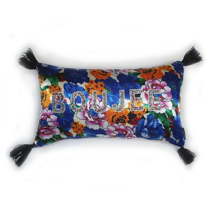 Hazeldee Home Handmade blue floral print cushion with rainbow rhinestone embellished letters spelling 'BOUJEE' and finished with bold silky black tassels.   The silky base exudes glamour and adds a level  of decadence to the the cushion.   Bold rainbow rhinestone letters bring out the bold blues, pinks, oranges and greens along.  Perfect for the person who loves a little something 'BOUJEE' or 'EXTRA' and lives life as such!