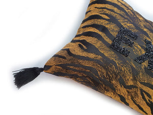 Handmade black and orange Tiger jacquard cushion with black rhinestone embellished letters spelling 'EXTRA' and finished with bold silky black tassels. A fun yet sophisticated take on animal homewares. Black rhinestone letters continues the bold but paired back theme. Perfect for the person who loves a little something 'EXTRA' or 'BOUJEE' and lives life as such!  Bold, sassy and fun, this cushion certainly makes a statement to any space! And of course those tassels add that 'EXTRA' touch of glamour!