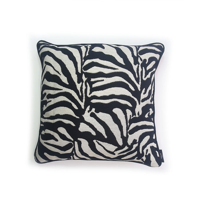 Hazeldee Home Limited Edition Handmade double-sided cushion with a bold monochrome cotton blend jacquard zebra design on one size and a vibrant fuchsia pink Italian cotton velvet on the reverse edged with a black cotton trim.     This cushion is fully reversible so you essentially get two looks in one!    Approximately 16