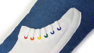 Hazeldee Home Handmade hi-top trainer cushion with real laces trim on a blue denim base.  We kept this version box fresh white and added colourful rainbow rivet detail for subtle colour and fun.  A great conversational trainer cushion for kids and grown ups alike!  Bring some fun and colour into your space with this handmade cushion with a hi-top trainer with laces detail!  White hi-top sneaker trainer cushion with rainbow coloured eyelets.  Approximately 12" x 20" (30cm x 50cm) with a zip opening. 