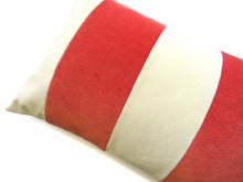Load image into Gallery viewer, A bold stripe lumbar cushion with influences taken from the coast.  Luxurious vibrant coral paired with contrasting cream velvet stripes that have a beautiful geometric aesthetic.  A fantastic way to introduce colour and an accompaniment to a maximalist interior.   Great by itself or paired with cushions from the Accent Collection, this style truly makes a statement!  
