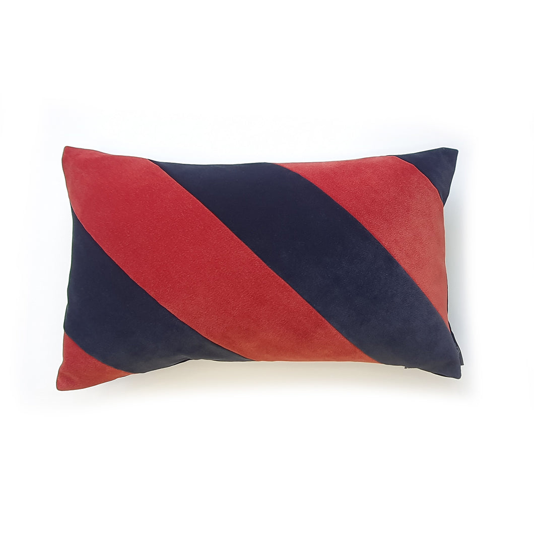 Hazeldee Home Handmade cotton Italian velvet striped rectangle cushion.  A bold diagonal stripe lumbar cushion with influences taken from the coast.  Rich rust paired with navy velvet stripes that have a beautiful geometric aesthetic.  A great addition to minimalist décor, a fantastic way to introduce colour and an accompaniment to a maximalist interior.   Great by itself or paired with cushions from the Accent Collection, this style truly makes a statement!  
