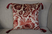 Load image into Gallery viewer, Hazeldee Home Handmade double-sided square velvet cushion with a Dutch inspired design in Regal Red from the Linwood Archive- a cream velvet with rust pheasant and filigree design print one side and Italian rust velvet on the reverse with bold contrast silky tassels.  Approximately 16&quot; x 16&quot; (40cm x 40cm) square with a concealed zip.  Comes with a polycotton lined cushion inner.
