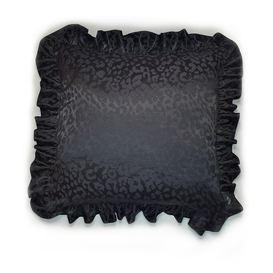 Hazeldee Home handmade black leopard jacquard design cushion with a fancy ruffle edge.  Perfect for living rooms and bedrooms alike.  A classy take on leopard that acts as a semi-plain print with silky and mat jacquard.  The ruffles add fun, romance and add that extra touch of glamour!  Approximately 18