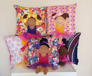 Hazeldee Home Handmade character kid's cushion with trim and legs that extend from the body of the cushion.    Designed and handmade by Hazeldee Home, these cushions are a bundle of fun! Each Cushion is one-of-a-kind with bright backgrounds, different skin tones and hairstyles with bows to match!  Approximately 16" x 16" (40cm x 40cm) with a centre back zip. Comes with a polycotton cushion inner.  Each Hazeldee Home Munchkin Character Cushion comes with a numbered Certificate of Authenticity.