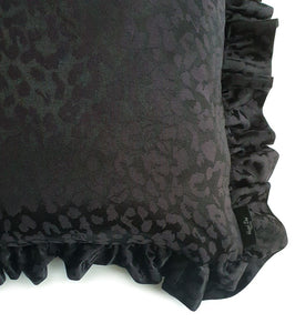 Hazeldee Home handmade black leopard jacquard design cushion with a fancy ruffle edge.  Perfect for living rooms and bedrooms alike.  A classy take on leopard that acts as a semi-plain print with silky and mat jacquard.  The ruffles add fun, romance and add that extra touch of glamour!  Approximately 18" x 18" (45cm x 45cm) excluding the with a concealed zip. 